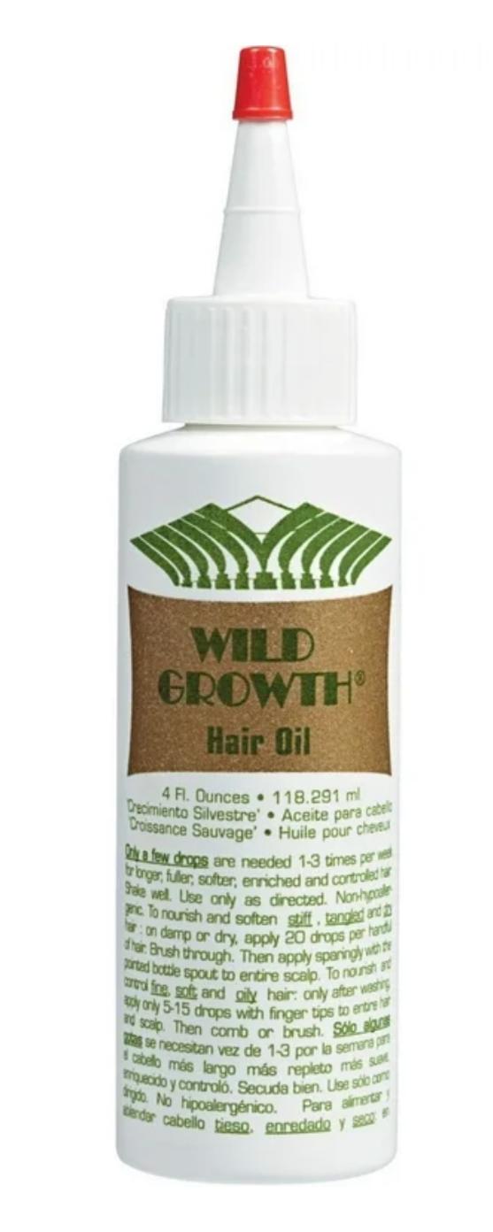 Bottle of Wild Growth hair oil with a white label on a white background