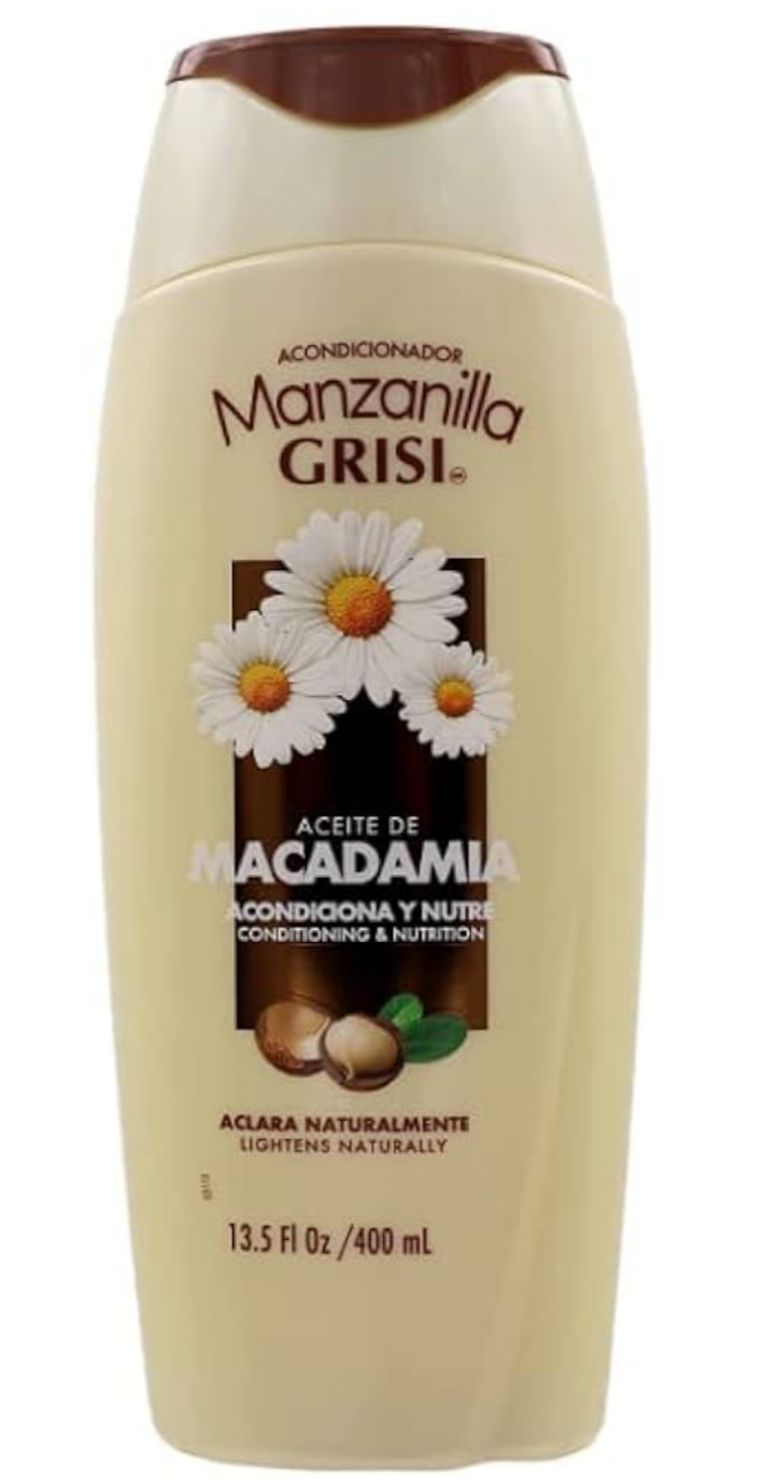 Manzanilla Grisi shampoo bottle with daisy and macadamia nut design on a white background