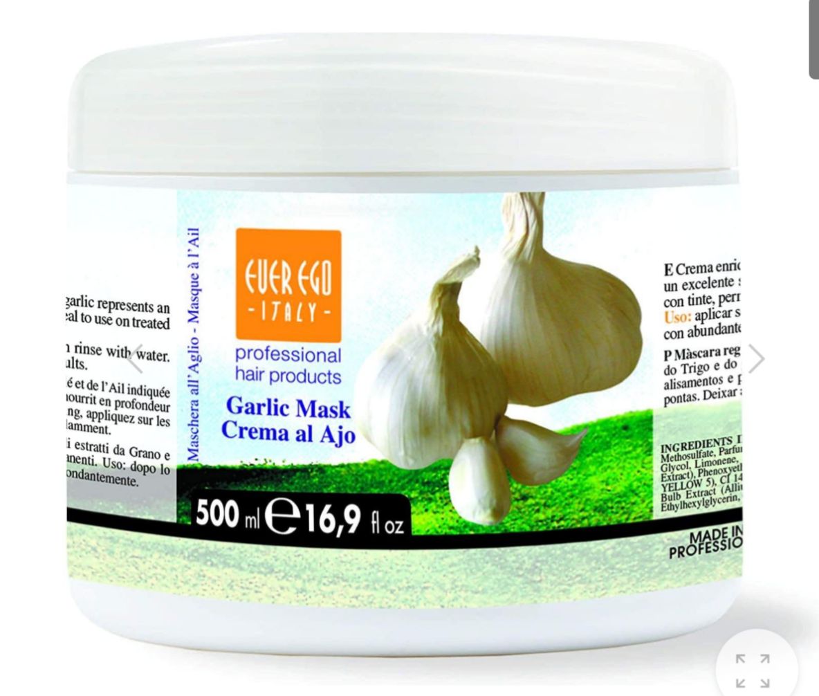 Garlic mask container with garlic bulbs on a white background