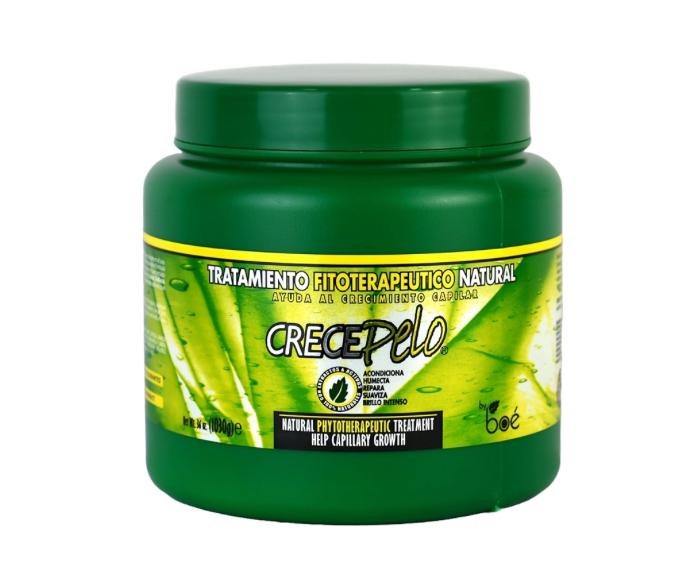 Green jar of CrecePelo hair growth treatment on a white background