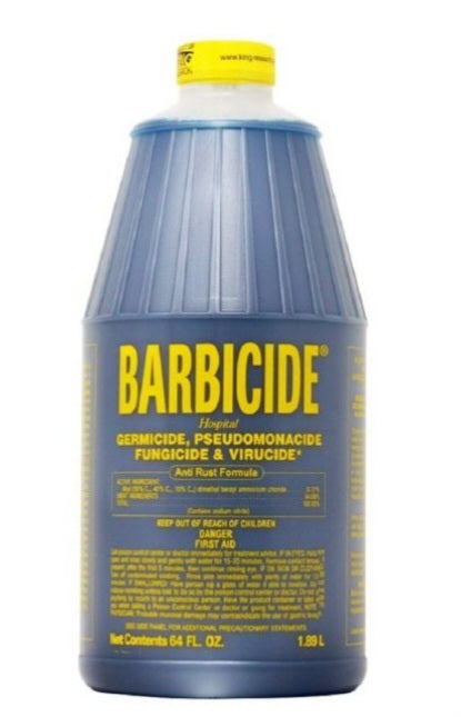 Barbicide bottle with blue label and yellow cap on a white background