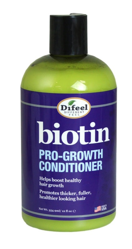 Biotin pro-growth conditioner bottle with purple label and green body on a white background