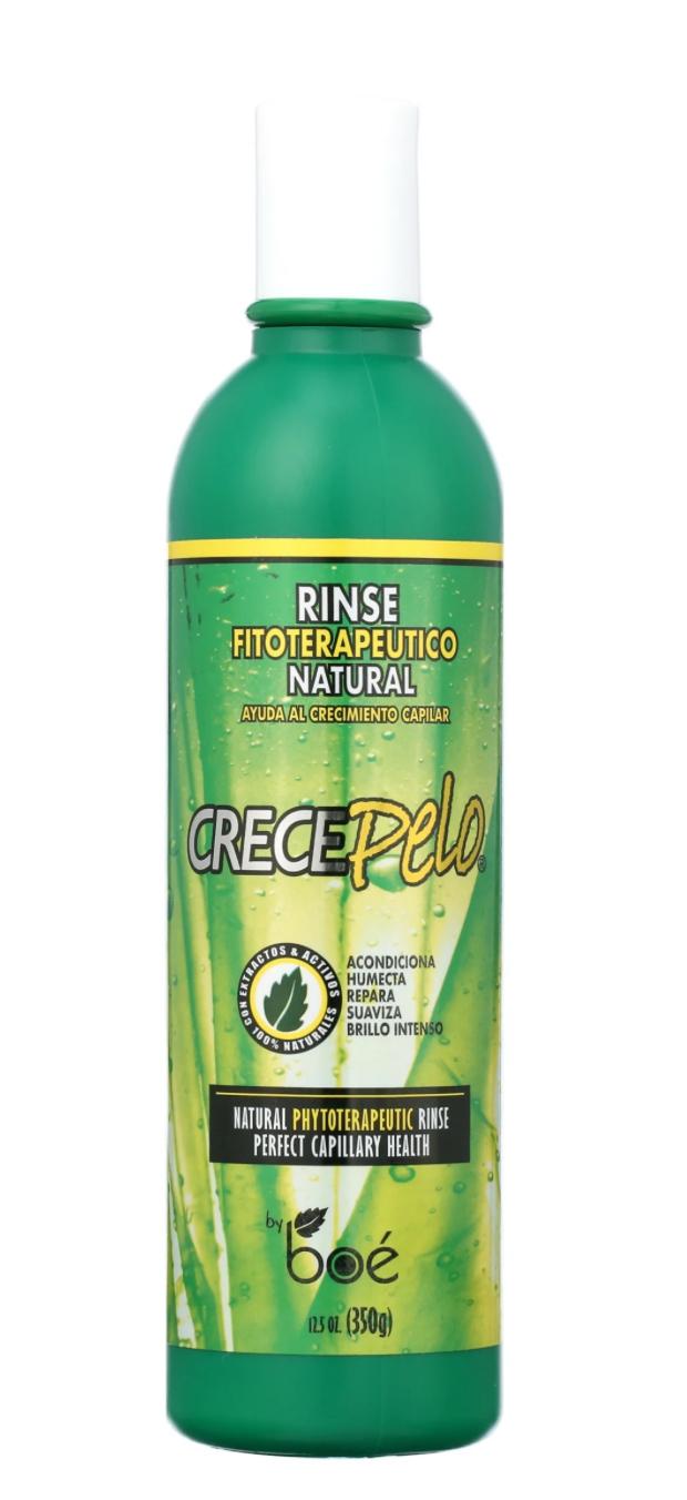 Green bottle of Crece Pelo hair care product on a white background