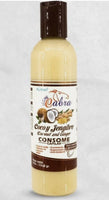 Bottle of 'The Albra' Cocony Jengibre Coconut and Ginger Consome on a light gray background