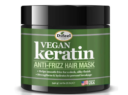 Green jar of Difeel Vegan Keratin Anti-Frizz Hair Mask with black lid on a white background
