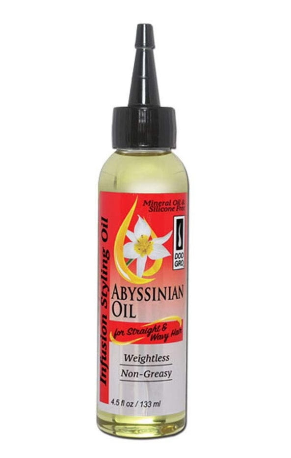 Bottle of Abyssinian oil with a red label on a white background