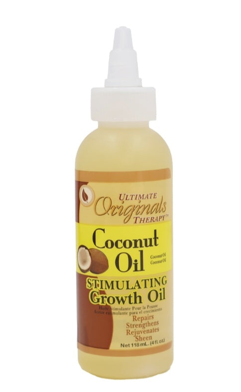Coconut oil stimulating growth oil bottle with label on a white background
